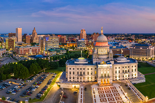 An aerial shot of the large domed capital building at sunset in downtown Providence Rhode Island
